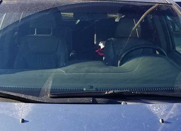 Garmin 65W dash cam installed on Honda Odyssey just under the rear view mirror