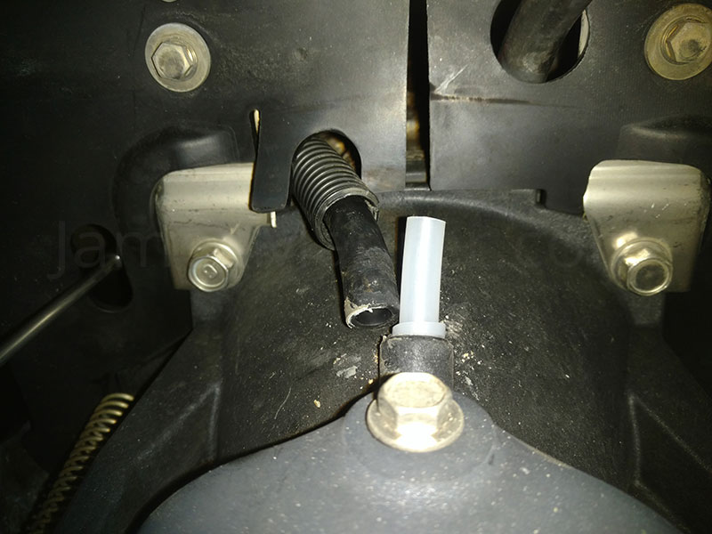 New siphon tube inserted into the water exhaust of a Yamaha Waverunner VX1100 before gluing