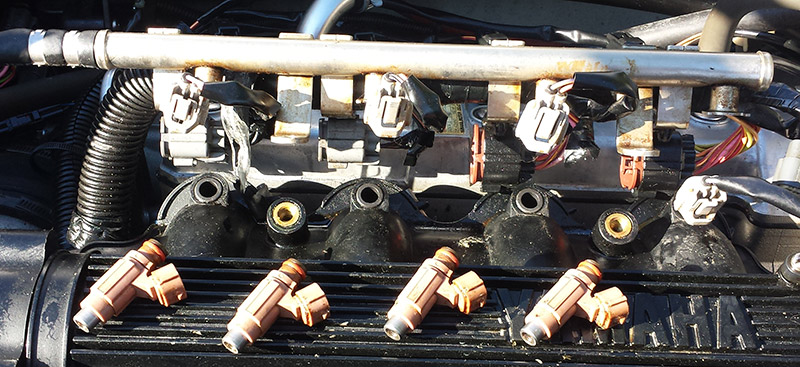 Fuel injectors pulled from a Yamaha Waverunner VX1100 for cleaning