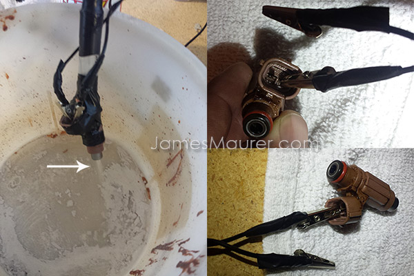 Waverunner fuel injector being cleaned with carb cleaner - mist visible from the four spray holes